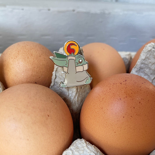 Runaway Baby Frog Egg Enamel Pin